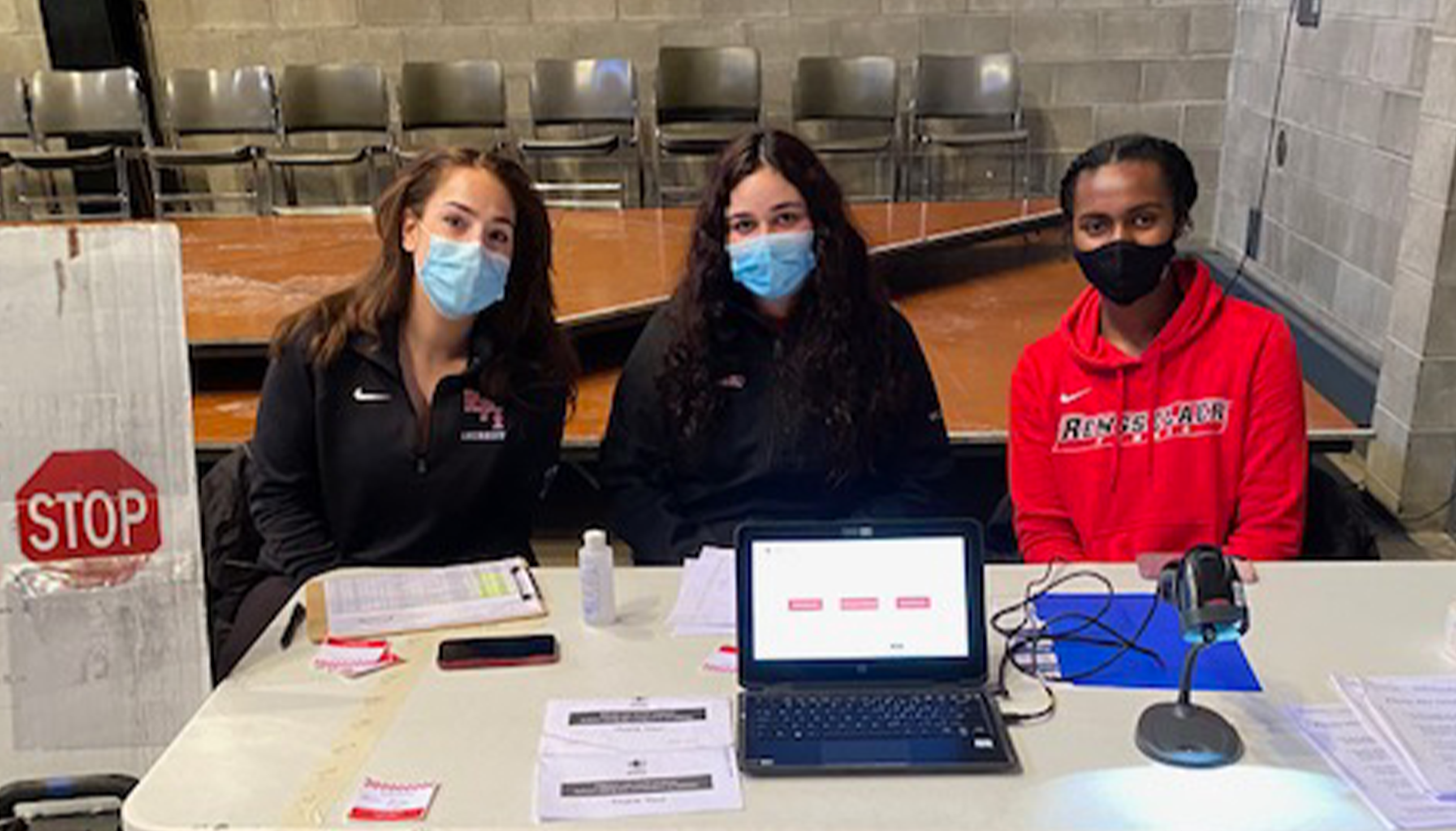Student-athletes at blood drive check-in table