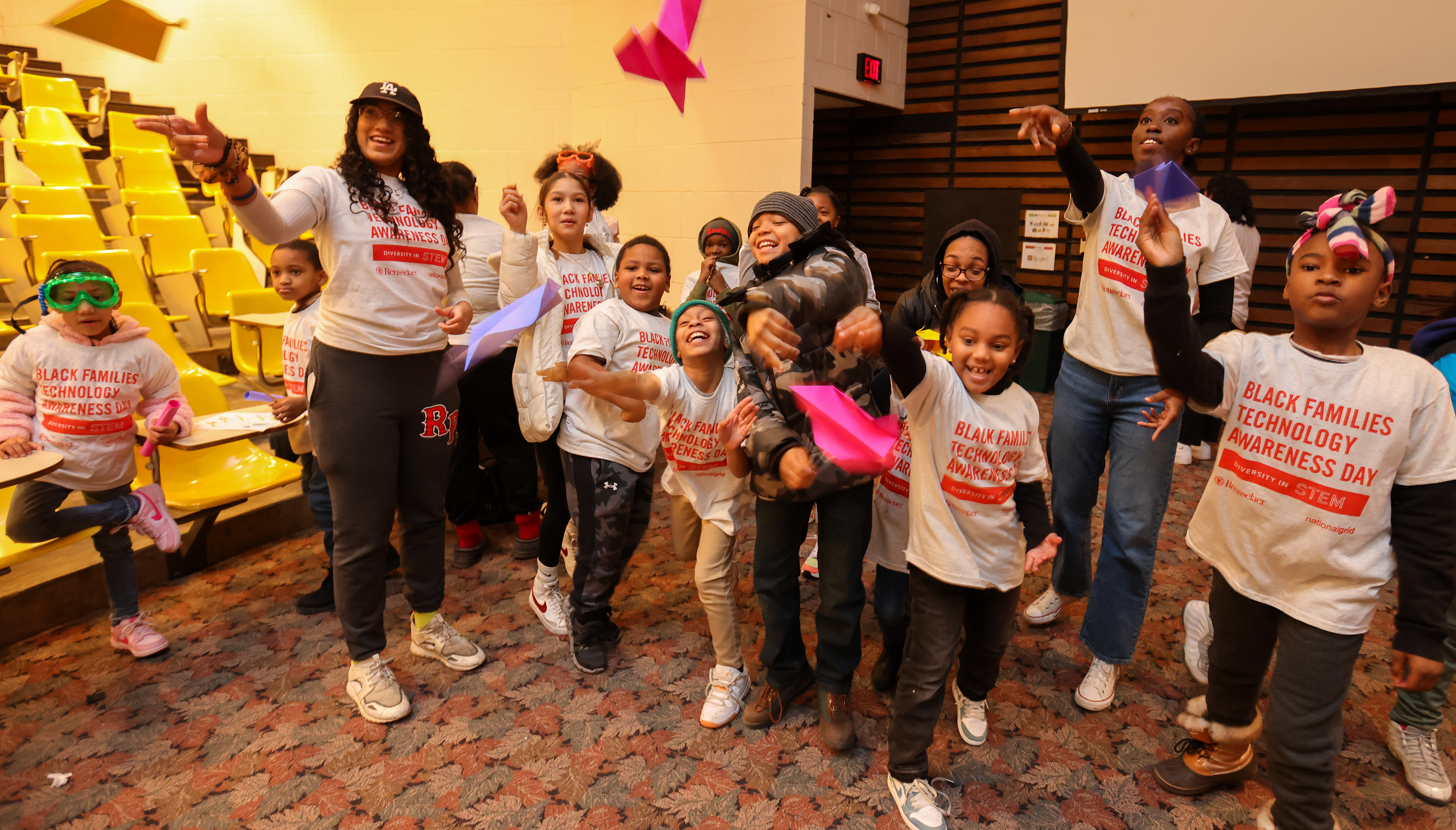 Students fly paper airplanes at Black Families Technology Awareness Day 2023